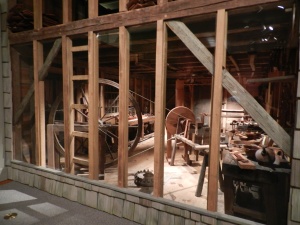 Peering into the Dominy Furniture Workshop from Long Island, NY you can see the great wheel lathe and workbenches