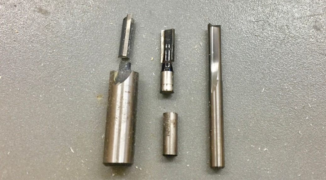 Left to Right -- 1/4" straight bits -- MLCS 1/2" shank (broken), Craftsman 1/4" shank, Freud Diablo Solid Carbide